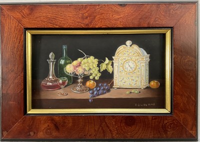 Lot 85 - Enid Clarke RMS (1919-2020) pair of miniature oils on panel depicting still life with decanters and fruit 'The Antique Clock' and 'Brass jug and fruit', together with copy of the original receip...