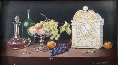 Lot 85 - Enid Clarke RMS (1919-2020) pair of miniature oils on panel depicting still life with decanters and fruit 'The Antique Clock' and 'Brass jug and fruit', together with copy of the original receip...