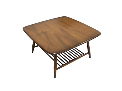 Lot 5308 - Ercol coffee table with stick under shelf measuring approximately 75cm x 75cm x 40cm