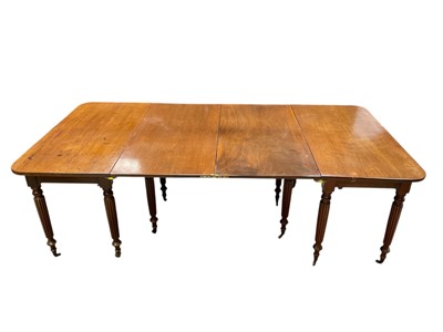 Lot 1295 - Unusual 19th century mahogany extending dining table, with folding centre section and two ends, raised on fluted tapered legs and castors