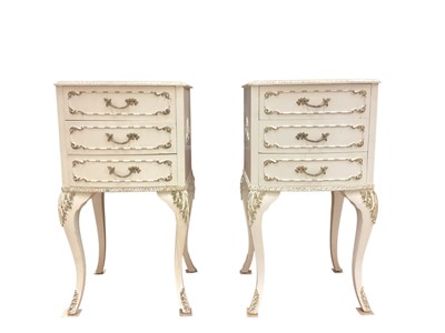 Lot 1355 - Pair of white and gilt painted three drawer bow fronted bedside chests