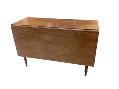 Lot 1356 - George III mahogany drop-flap dining table on ring turned legs