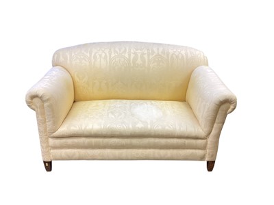 Lot 1395 - Edwardian drop-end twin seater sofa upholstered in yellow fabric, on square taper legs