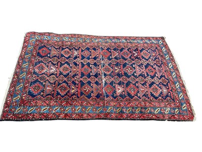 Lot 1484 - Eastern rug on red and blue ground