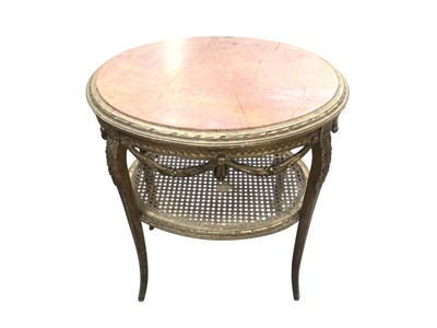 Lot 1269 - Early 20th century French gilt two tier table with inset oval marble top above a bergère tier below