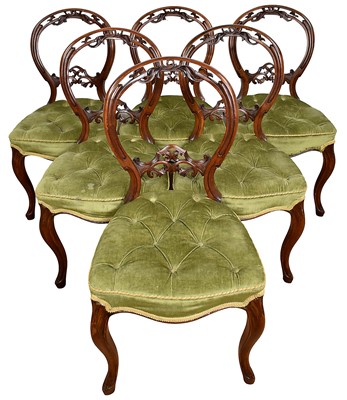 Lot 1260 - Set of six Victorian walnut dining chairs with carved balloon backs, buttoned green velvet seats, on scroll legs