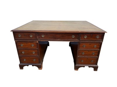 Lot 1406 - Georgian style mahogany twin pedestal partners desk with an arrangement of nine drawers and three drawers with twin cupboards to the opposing side