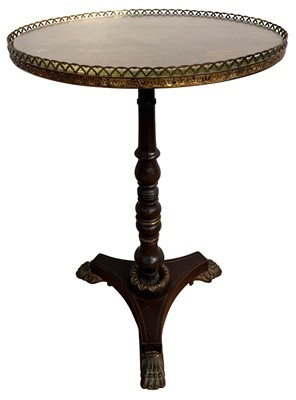 Lot 1404 - Fine quality 19th century rosewood side table, the oval top with brass gallery, turned column and trefoil base with ormolu paw and scroll feet on castors
