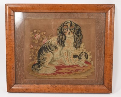 Lot 697 - Victorian woolwork panel depicting a Spaniel and Puppy, in maple veneered frame