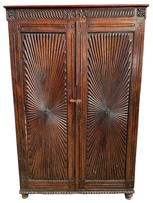 Lot 1412 - Late 18th / early 19th century and later Ceylonese carved hardwood cupboard with twin carved starburst panel doors
