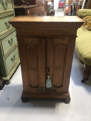 Lot 5336 - Early 20th century cigar cabinet, panelled doors, on bun feet
