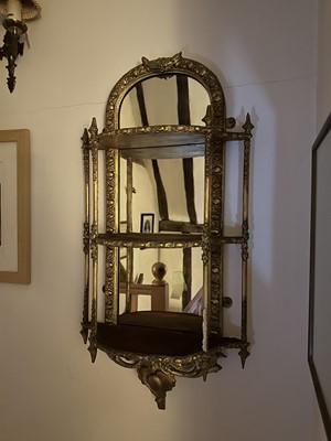 Lot 5349 - Victorian gilt three tier hanging shelves with mirrored back