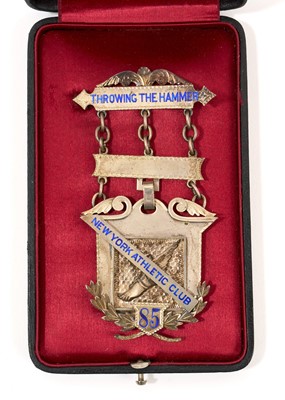 Lot 707 - Late 19th century enamelled white metal New York Athletic Club medal