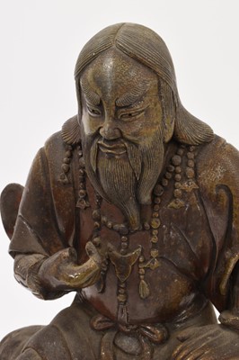Lot 40 - Chinese bronzed ceramic figure of seated figure