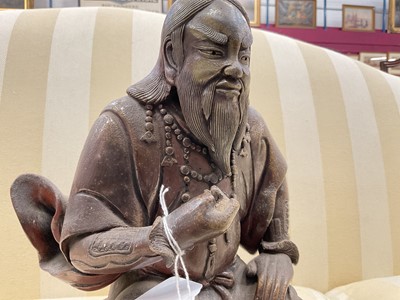 Lot 40 - Chinese bronzed ceramic figure of seated figure