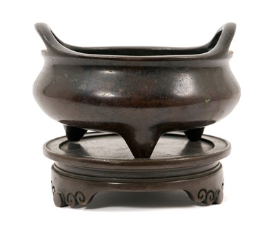 Lot 711 - Chinese bronze tripod censer on stand
