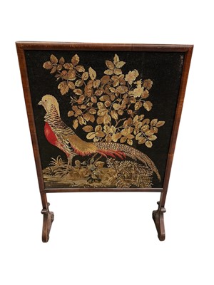 Lot 1301 - Victorian mahogany framed fire screen with woolwork panel depicting a golden pheasant, on shaped scroll supports