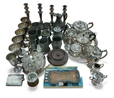 Lot 402 - Collection of assorted metalwares to include a set of four candlesticks, three three piece silver plated teasets, silver plated tray, pewter tankards and other items.