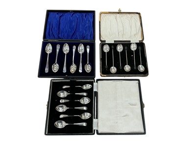 Lot 967 - Three sets of silver coffee spoons in fitted cases