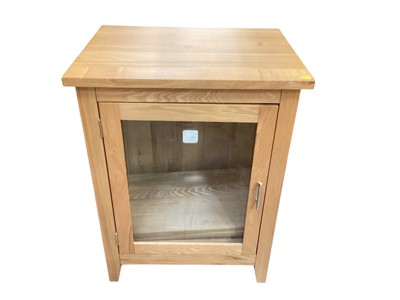Lot 1303 - Contemporary light oak hi-fi cabinet with single glazed hinged door.