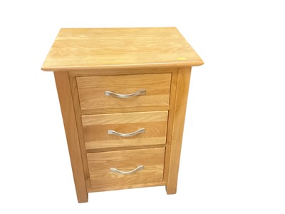 Lot 1308 - Contemporary light oak bedside cabinet with three drawers