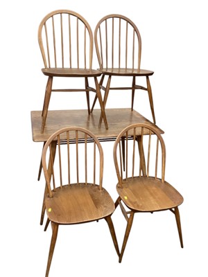 Lot 1321 - Ercol dining table and four stick back chairs.