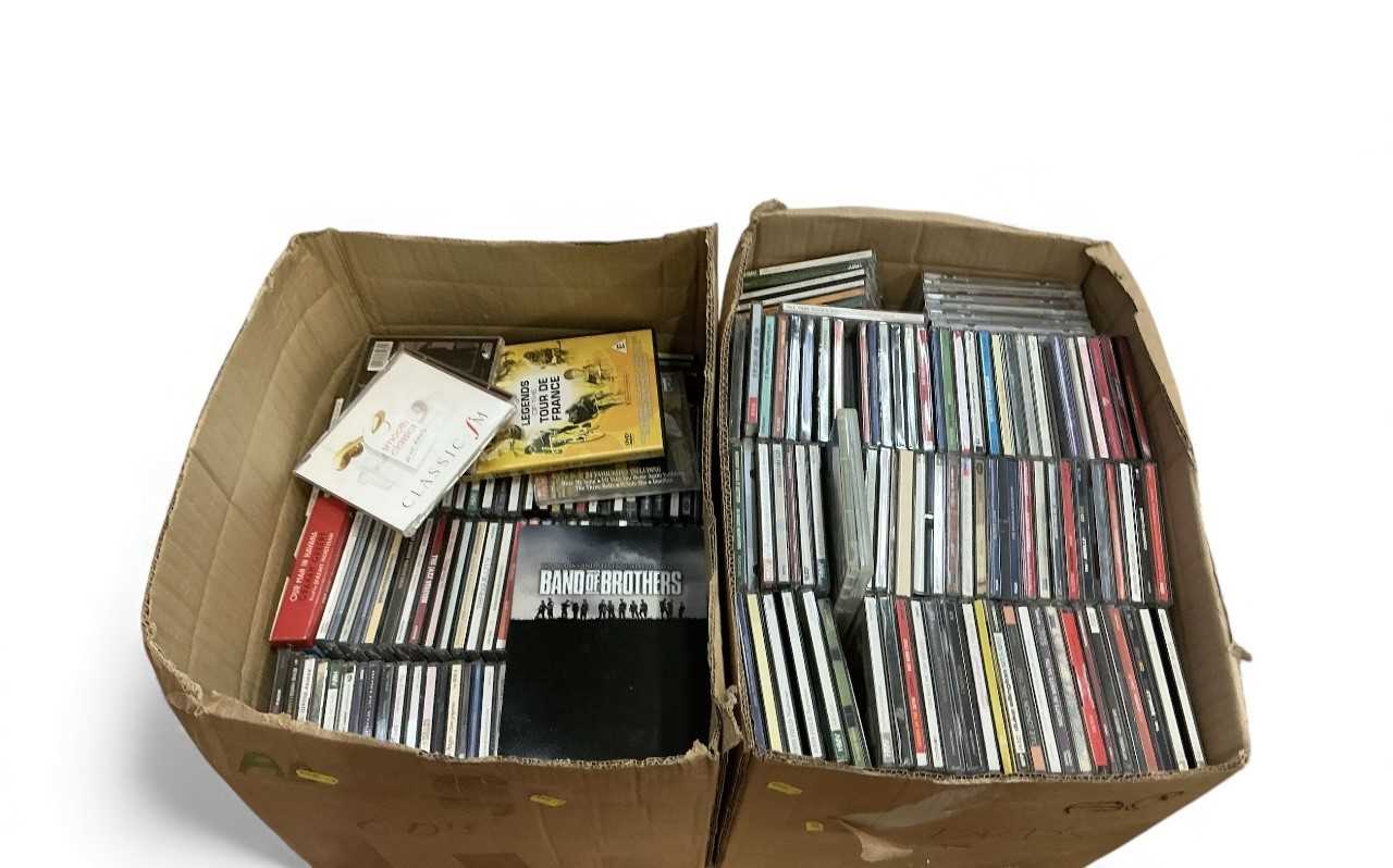 Lot 438 - Two boxes of assorted CD's and DVD's (2