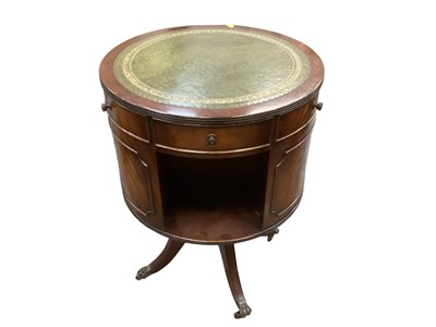 Lot 1332 - Georgian style revolving drum table with shelves and drawers, leather top