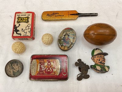 Lot 82 - Group of small tins and other items, including a Rowntree's Cachous cricket bat, an American football, a Cadbury's match box, a German pencil sharpener in the form of a jockey, etc