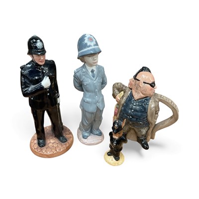 Lot 14 - Four policeman figures, including two by Royal Doulton, one Lladro and one Bunnykins