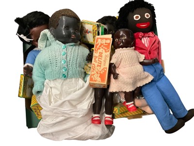 Lot 268 - Box of vintage dolls and a golly together with boxed Pedigree Delite doll