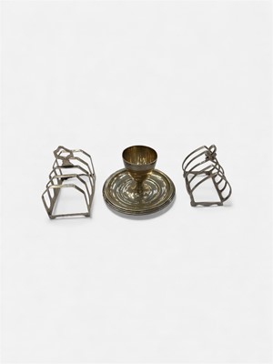 Lot 996 - Silver egg cup ( Birmingham 1925) and two silver toast racks (3), 6ozs