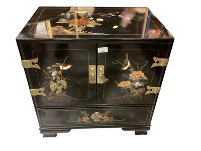 Lot 1342 - Chinese black lacquer two door cabinet decorated wit...