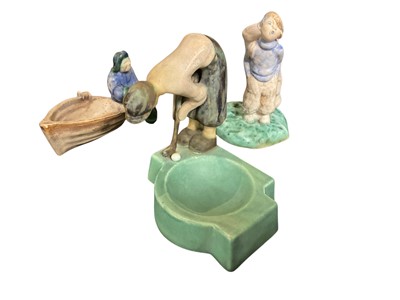 Lot 158 - Rare Denby golfer ashtray, together with a similar figural spill vase and another