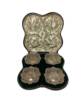 Lot 211 - Set of four Victorian silver dishes, with pierced and chased decoration