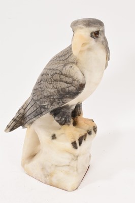 Lot 806 - French carved alabaster bird of prey with glass eyes, perched on a rocky base