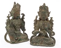 Lot 706 - Pair of antique Tibetan bronze deity figures,...