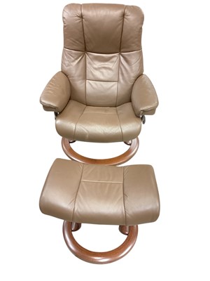 Lot 1383 - Brown leather recliner chair and stool by Stressless