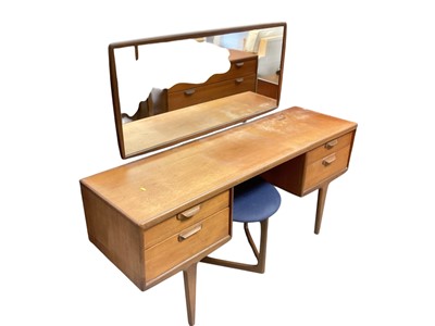 Lot 1375 - Mid century teak dressing table with mirror back, 152cm wide, 46cm deep, 122cm high, together with a stool and a chair (3)