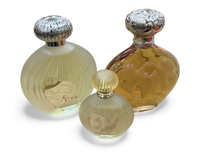 Lot 484 - Three modern Lalique glass perfume bottles with contents.