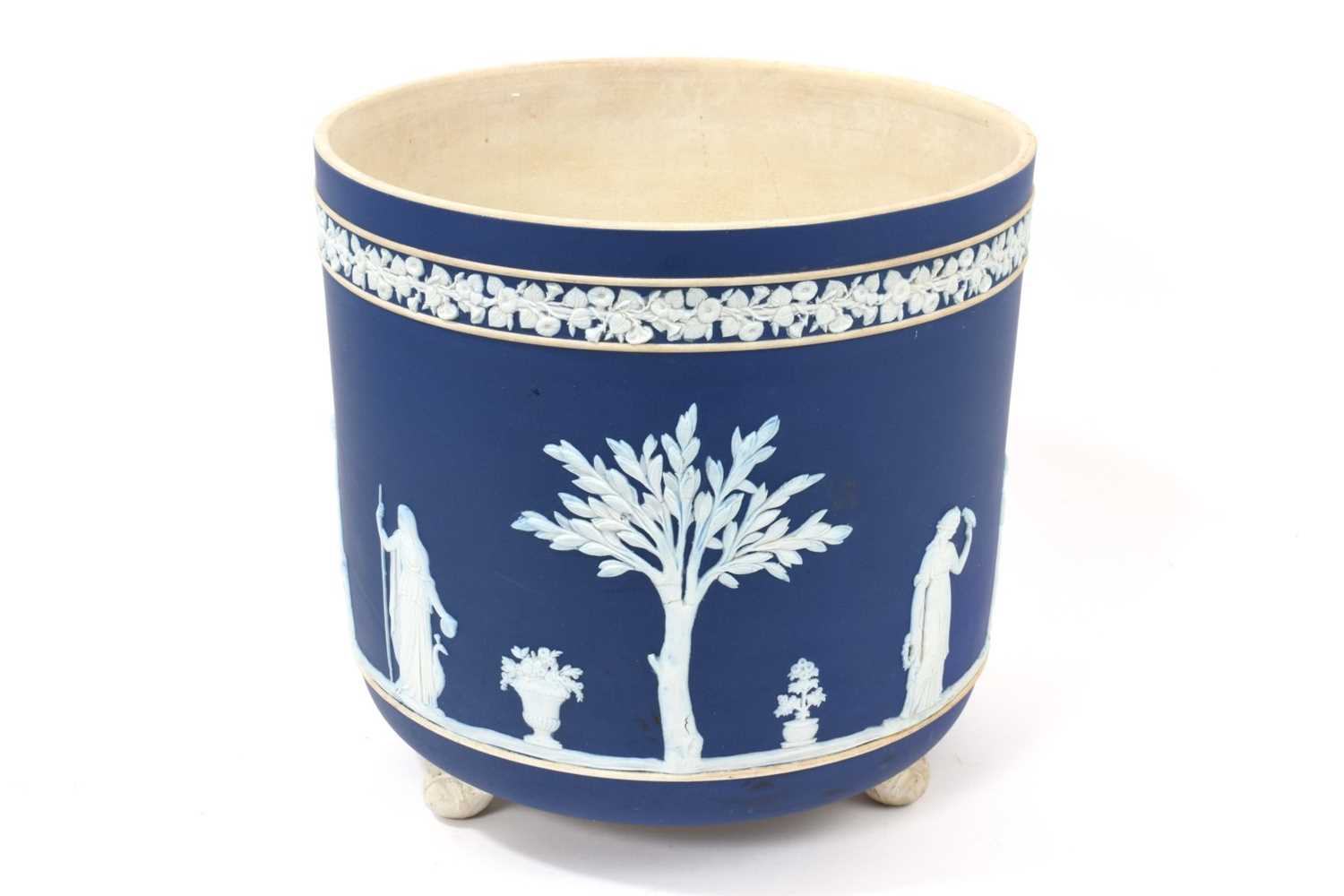 Lot 31 - Large Victorian Wedgwood Jasperware jardinière, raised on three feet, with impressed marks to base- 'Wedgwood England', 23cm in overall height, 24cm in overall diameter.