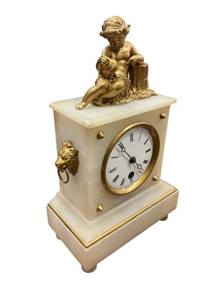 Lot 203 - 19th century Continental alabaster and gilt metal clock with cherub and column surmount