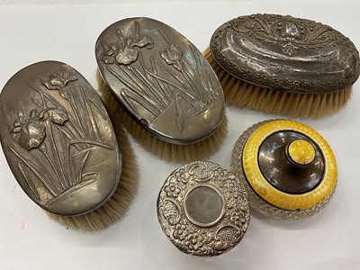 Lot 981 - Pair of Japanese silver mounted brushes with iris decoration, one other silver mounted brush, silver and enamel glass powder pot and a silver mounted jar (5)