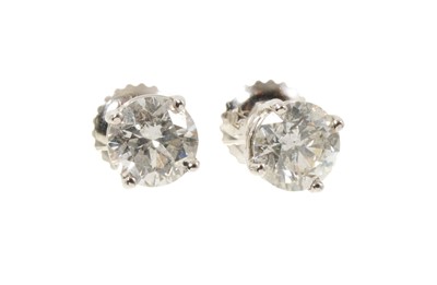 Lot 450 - Pair of diamond single stone stud earrings in 14ct white gold setting