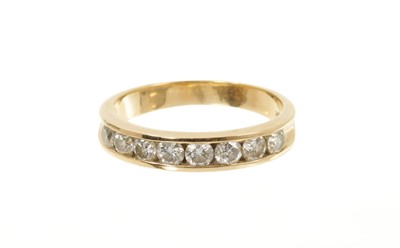 Lot 449 - Diamond eternity ring with a half hoop of eight brilliant cut diamonds