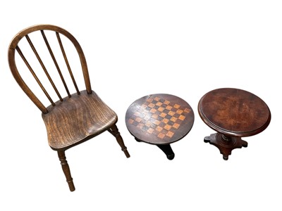 Lot 214 - 19th century miniature chess top tilt top table, together with another similar table and a small child's chair. (3)