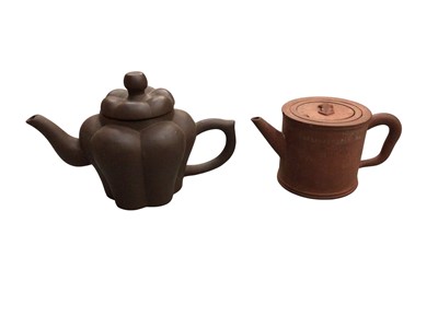 Lot 788 - Two Oriental tea pots one with Chinese character marks and a tea strainer inside