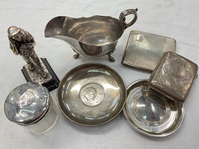 Lot 953 - Group of silver items to include a sauce boat, two cigarette cases, Churchill coin dish, one other pin dish, silver mounted glass jar and a plated Royal Corps of Signals figure (7)