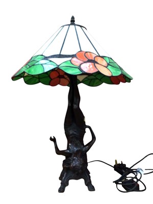 Lot 801 - Large Tiffany style lamp depicting a figure with stained shade