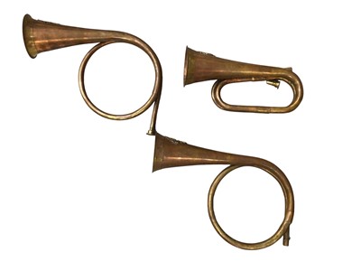 Lot 808 - Three copper horns with badges to the ends